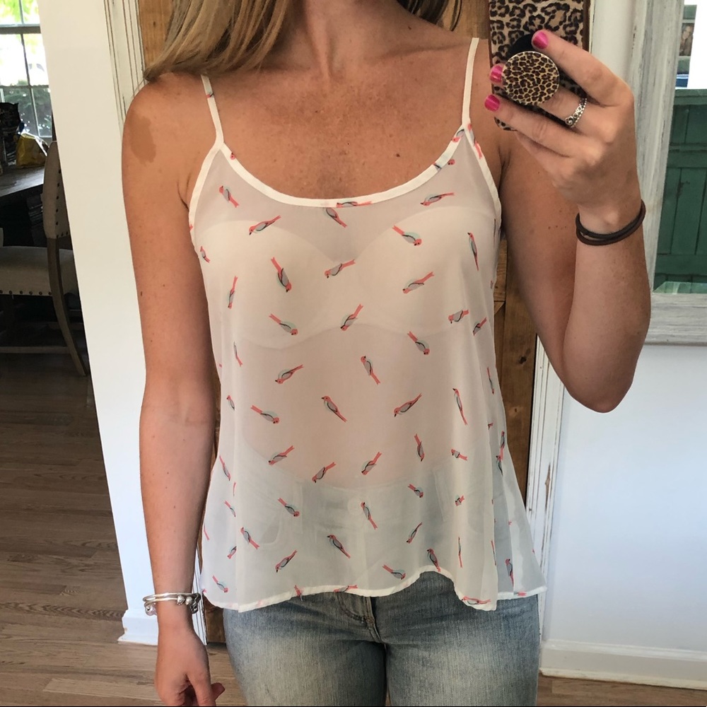 Sheer white tank with parrot pattern